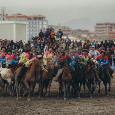 Horsemen taking part in a game of buzkashi