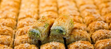 Golden Afghan baklava topped with pistachios