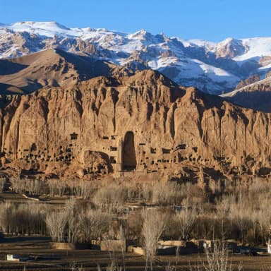 Snowy peaks above the historic cliffs of Bamyan