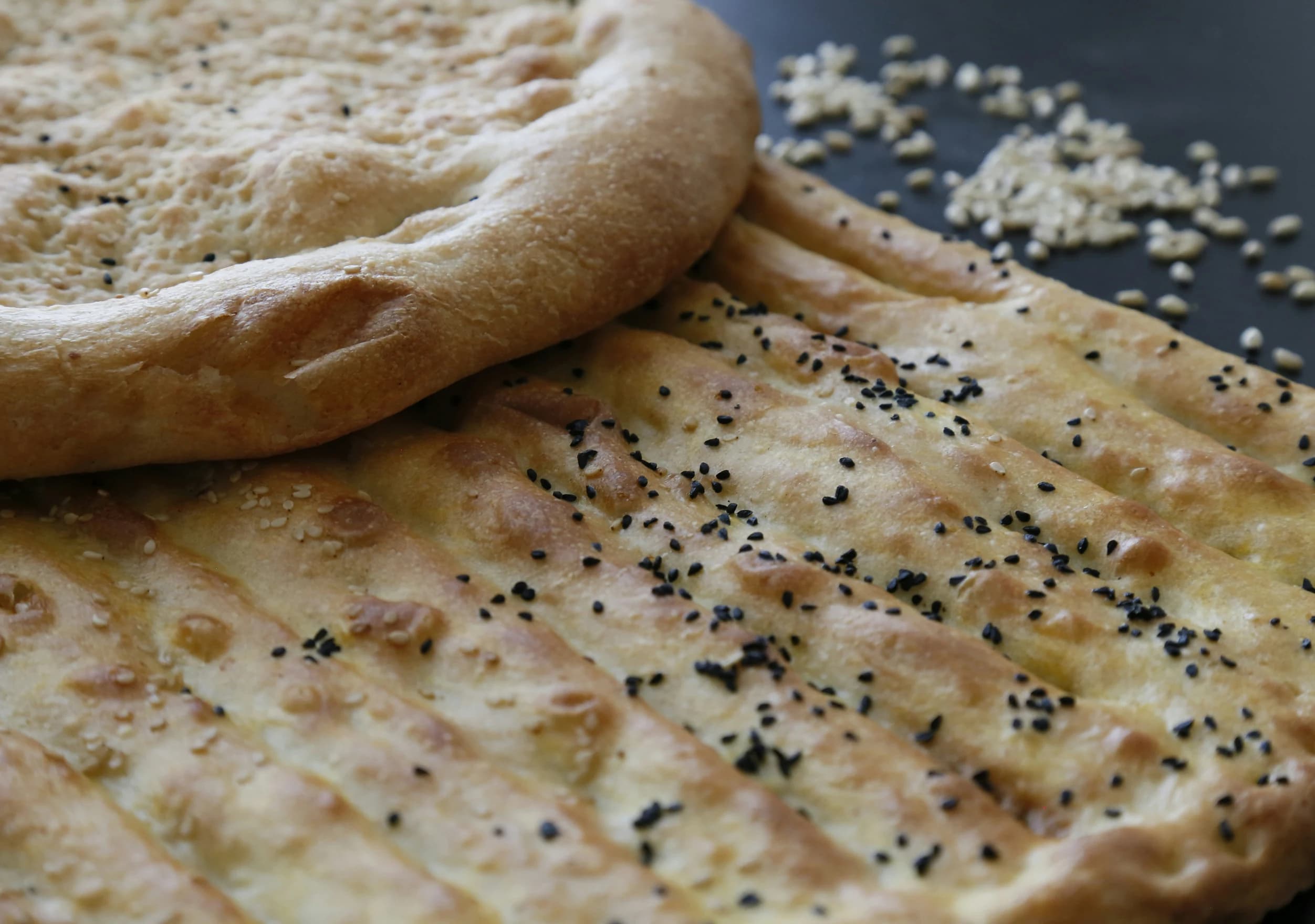 Fresh Afghan flatbread sprinkled with seeds