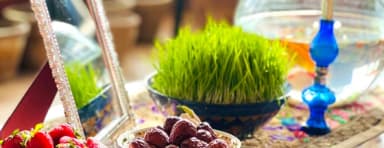 Flowers, fruit and traditional decorations on a Nowruz table